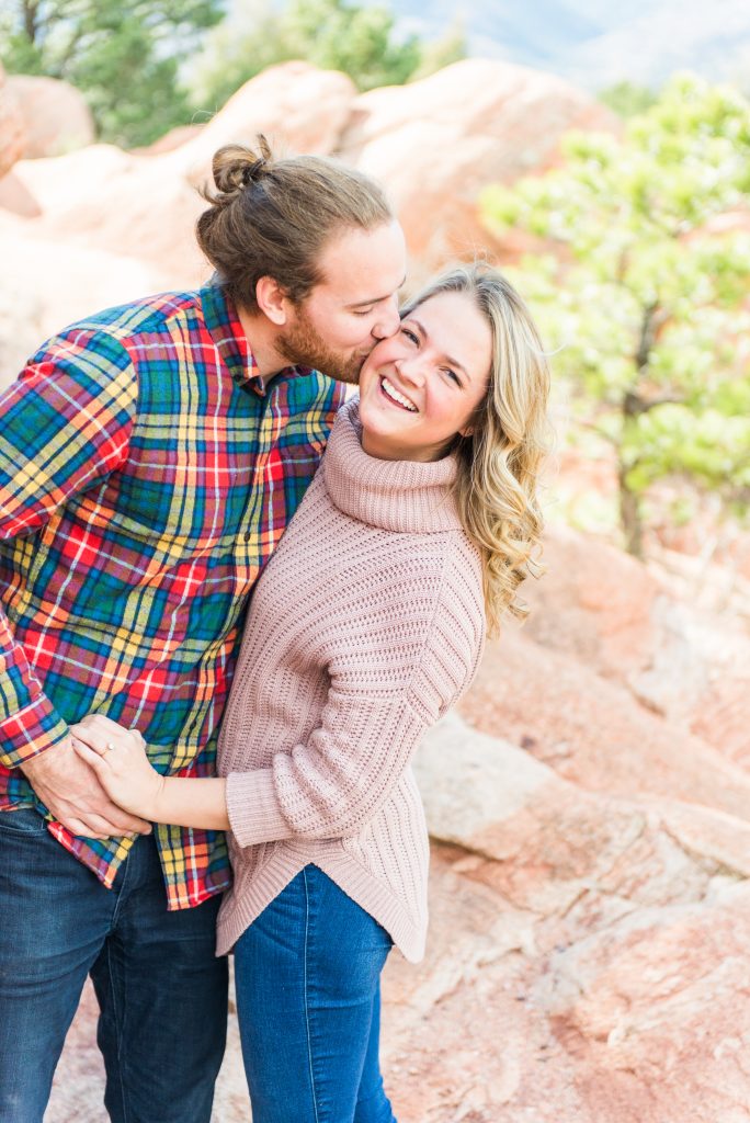 Colorado springs engagement session, Garden of the Gods engagement session, garden of the gods engagement photographer, colorado engagement photographer, colorado mountain engagement session, colorado engagement session, mountain engagement outfits, engagement session outfits, colorado wedding photographer, colorado springs, garden of the gods, mountain engagement, plaid shirt engagement session, pink sweater engagement session